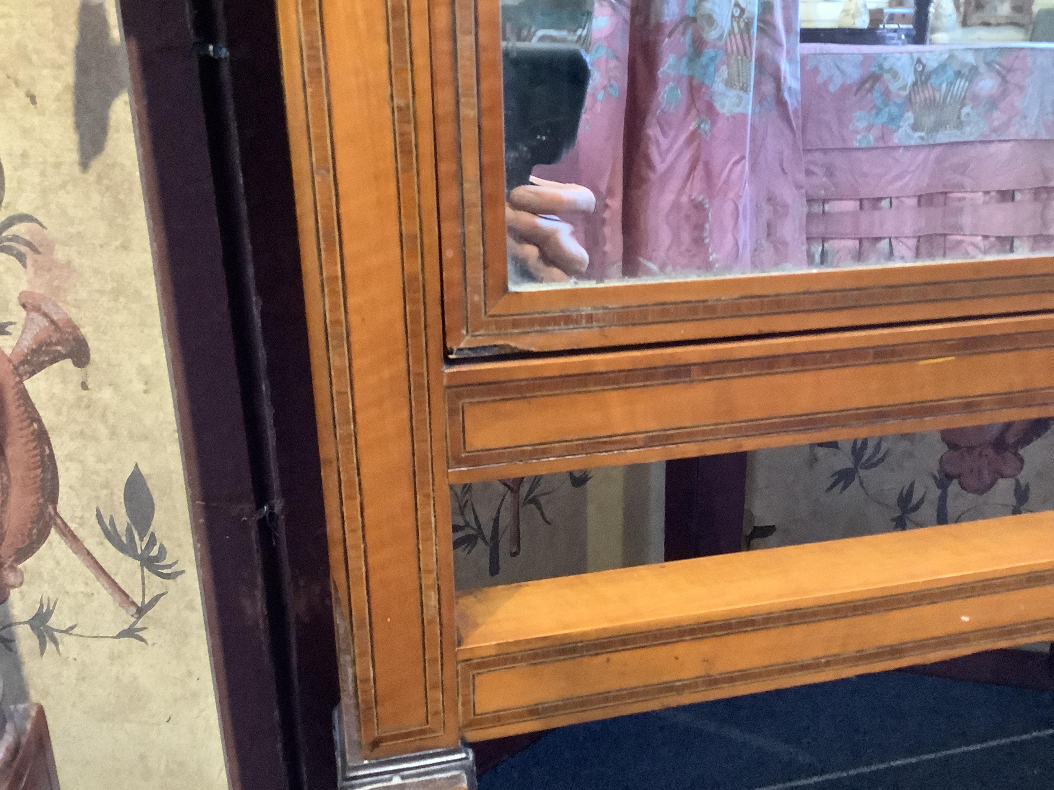 An Edwardian satinwood cheval mirror